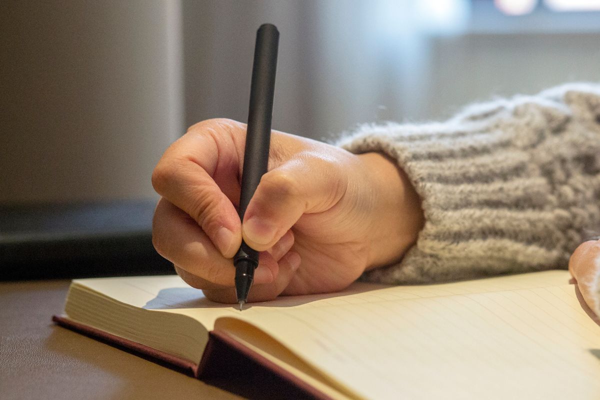 A picture of someone writing.