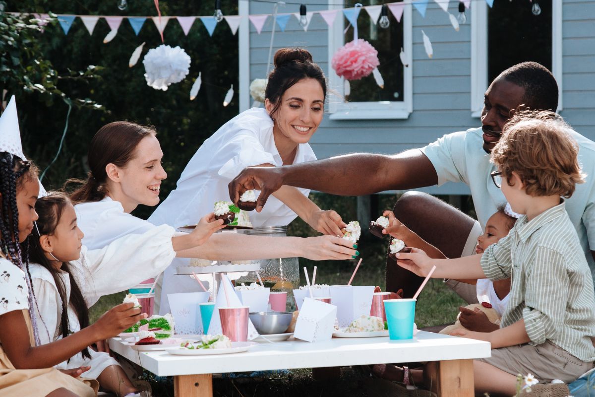 A picture of a birthday party outside.