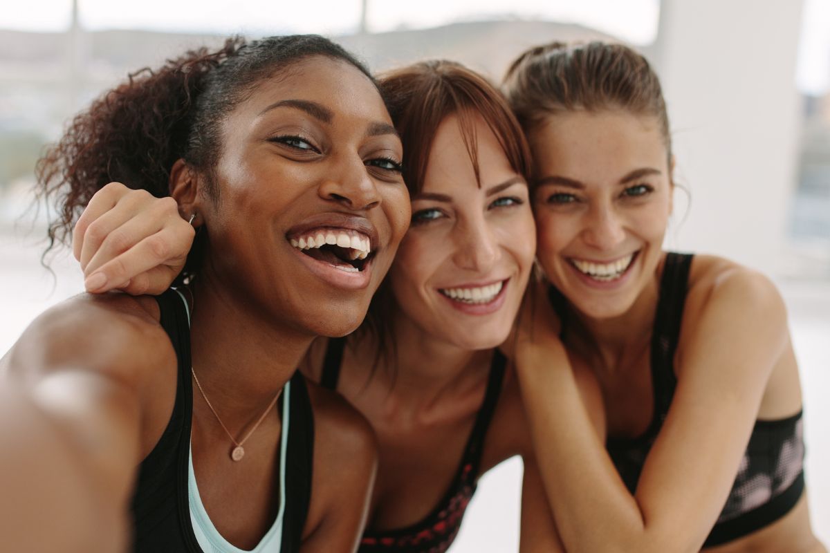 A picture of friends smiling.