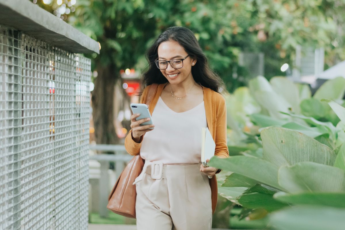 A picture of someone walking while smiling.