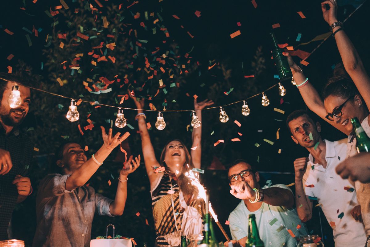 A picture of friends camping outside.