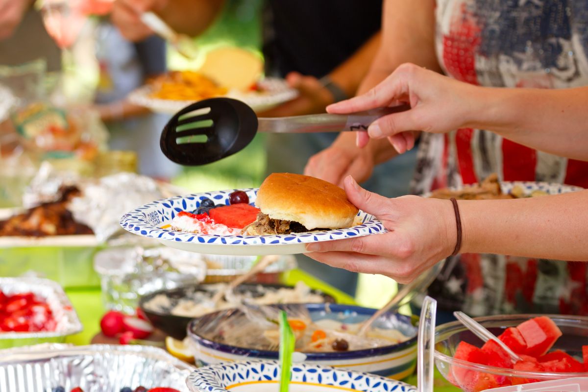 A picture of friends on a potluck.
