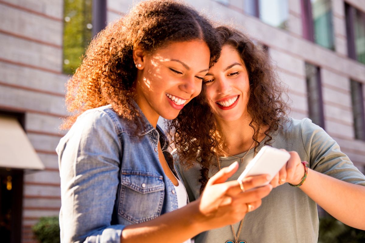 A picture of friends smiling.