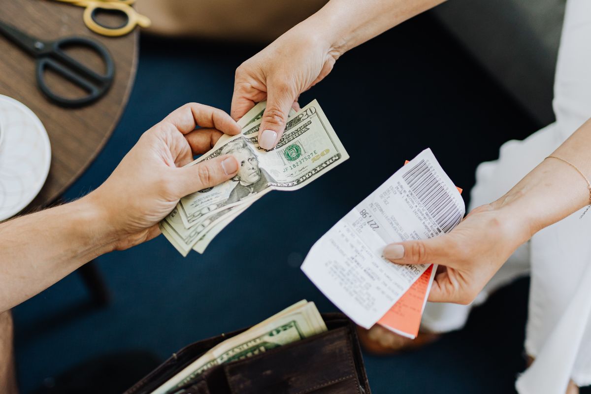 A picture of someone paying debt.