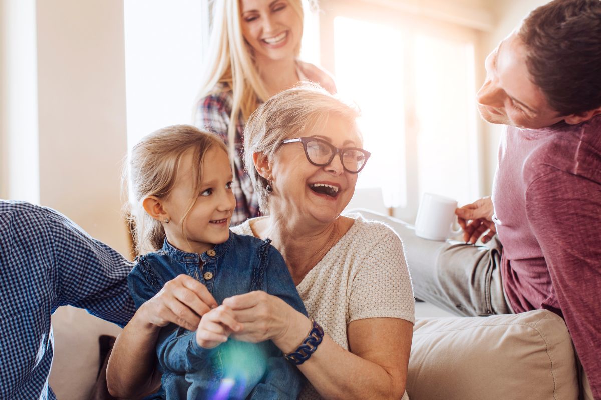 A picture of a grandma and her family.