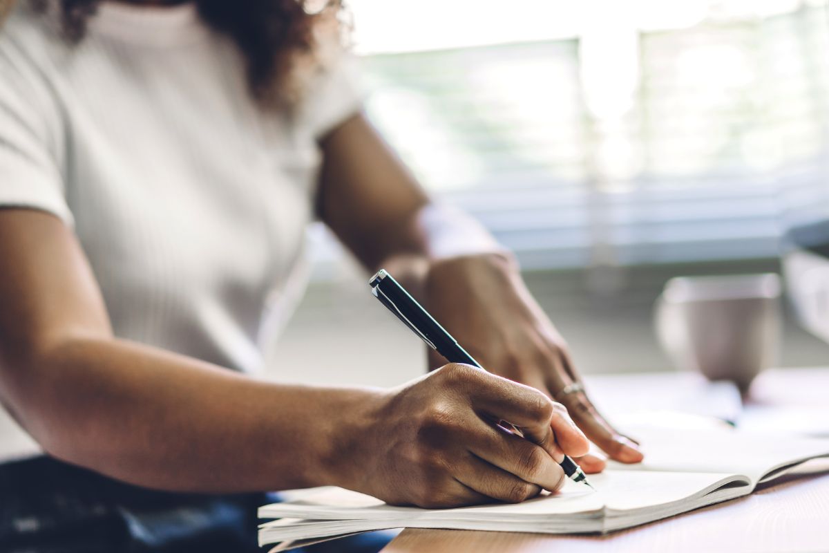 A picture of someone writing.