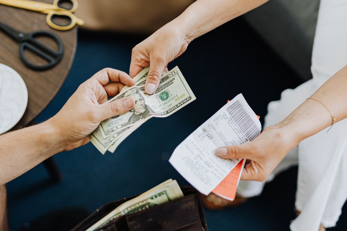 A picture of someone paying off debt.