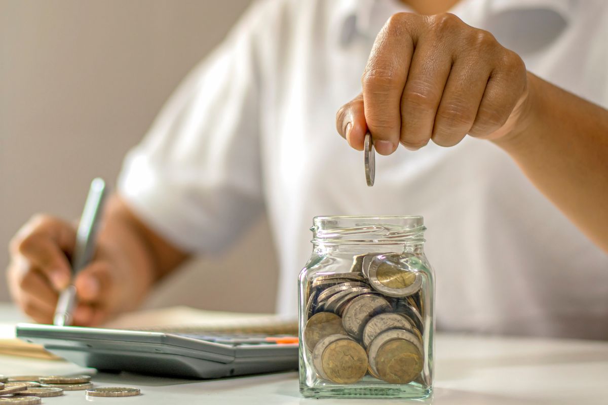 A picture of someone saving their coins.