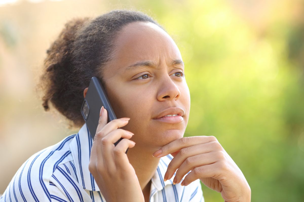 A picture of a lady calling someone.