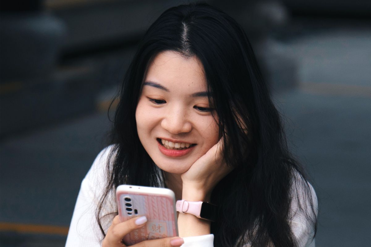 A picture of someone using their phone.