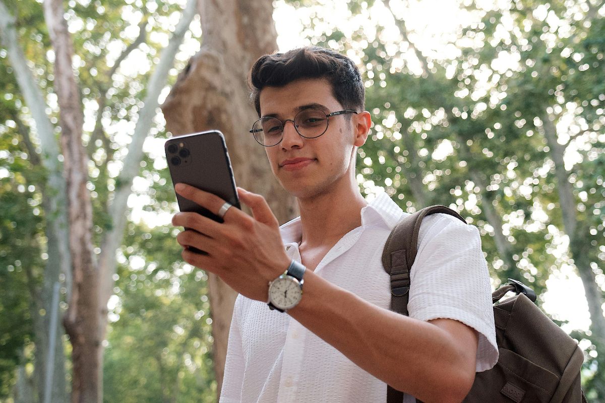 A picture of someone looking at their phone.