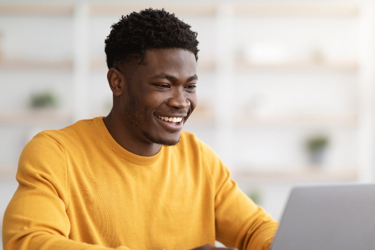 A picture of someone using their laptop.