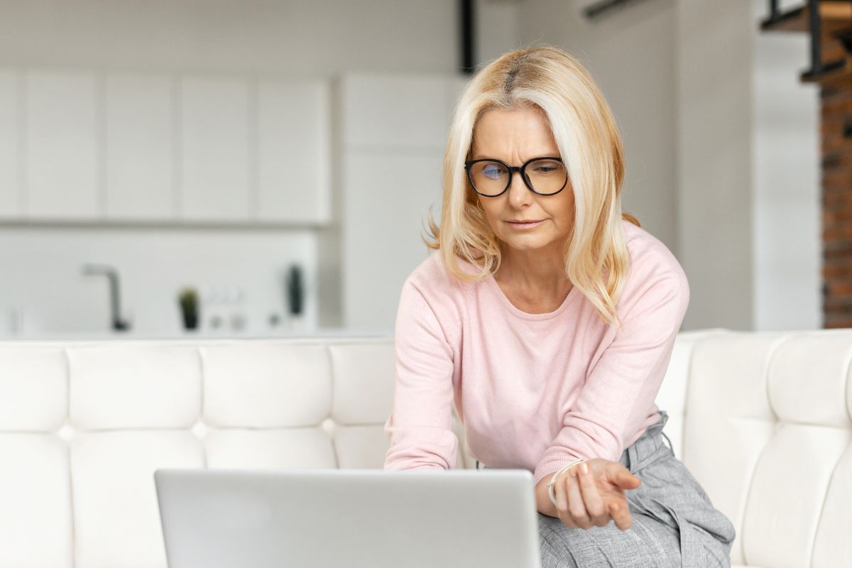 A picture of someone using their laptop.