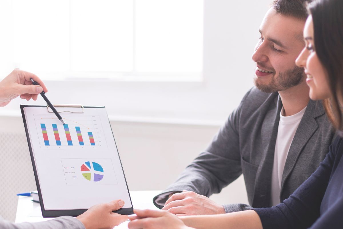 A picture of a couple with a financial advisor.