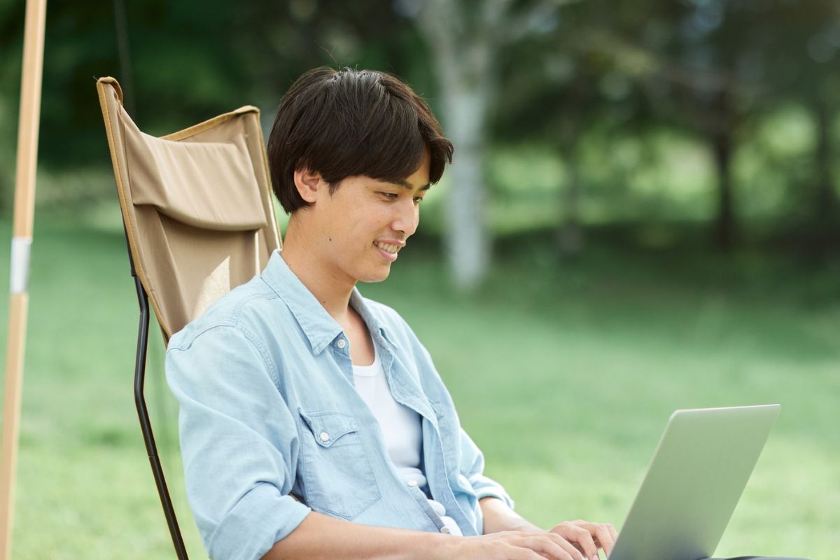 A picture of someone using their laptop.