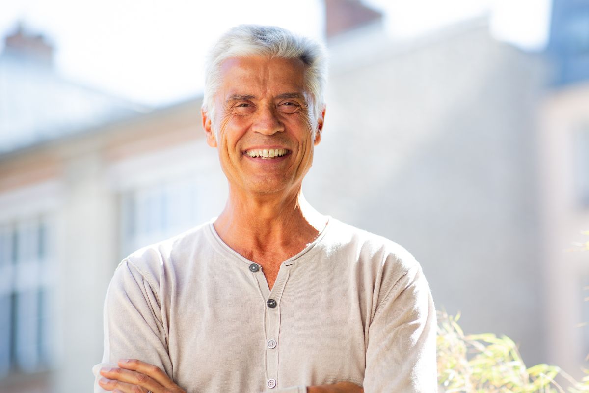 A picture of an elderly person smiling.