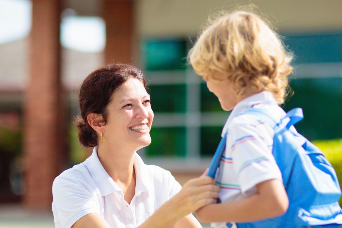 A picture of a smiling mom and son.