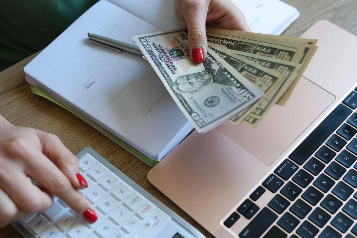 A picture of someone counting money.