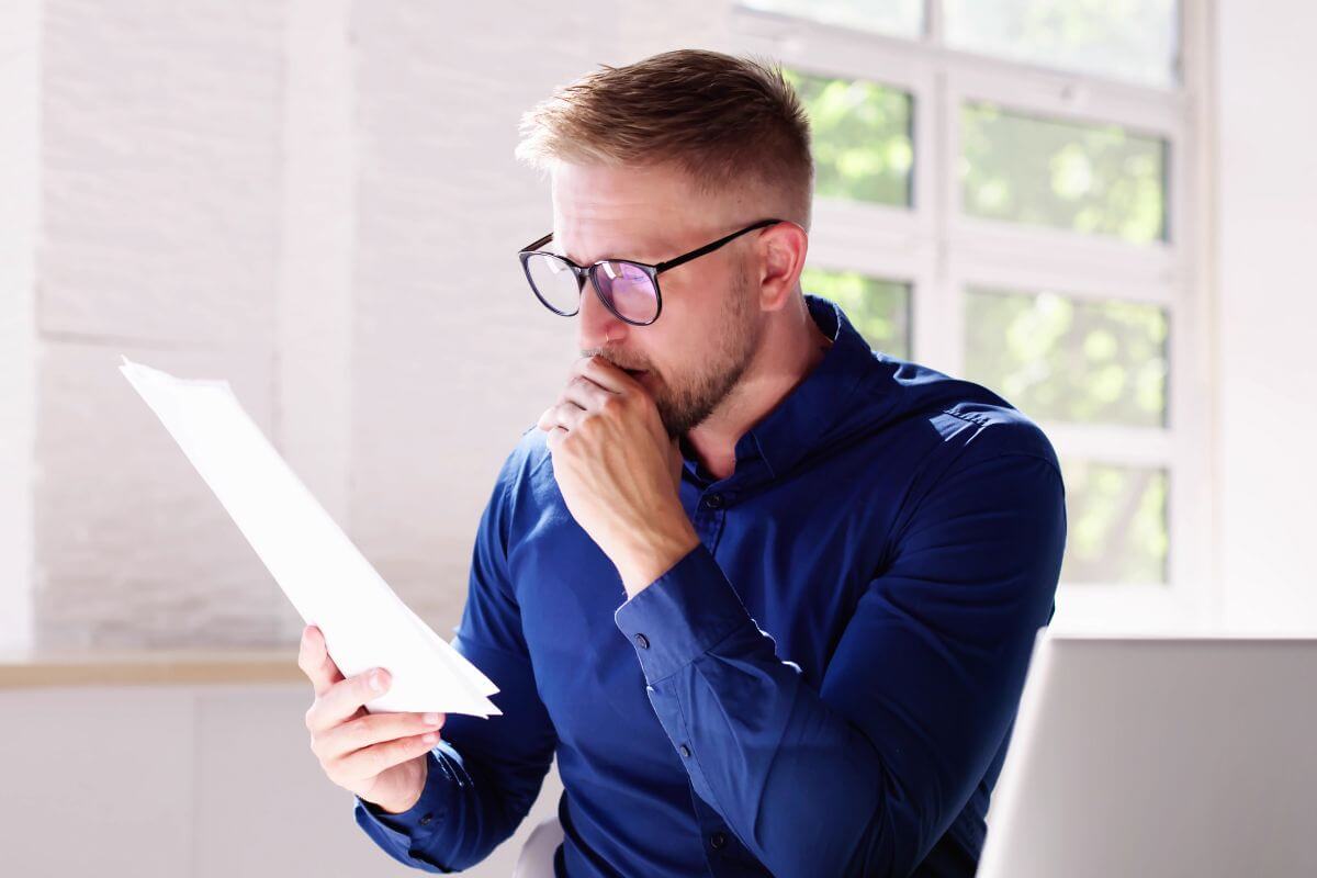 A picture of someone looking at papers.