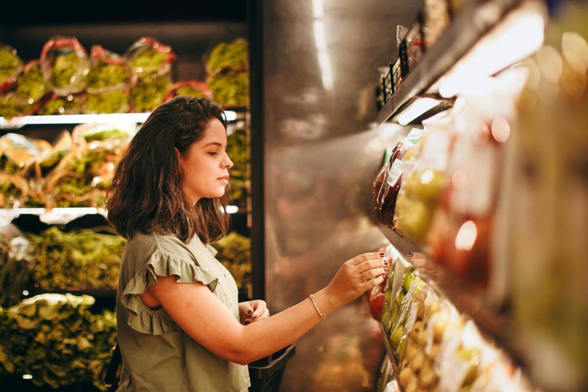 A picture of a woman grocery shopping.