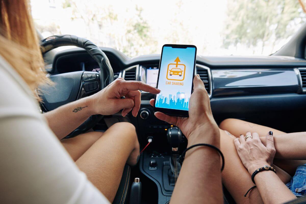 A picture of someone doing car sharing. 