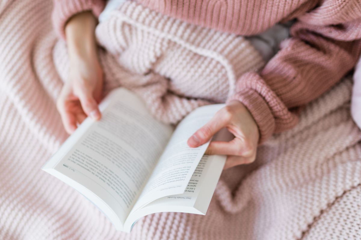 An image of a woman reading a book.