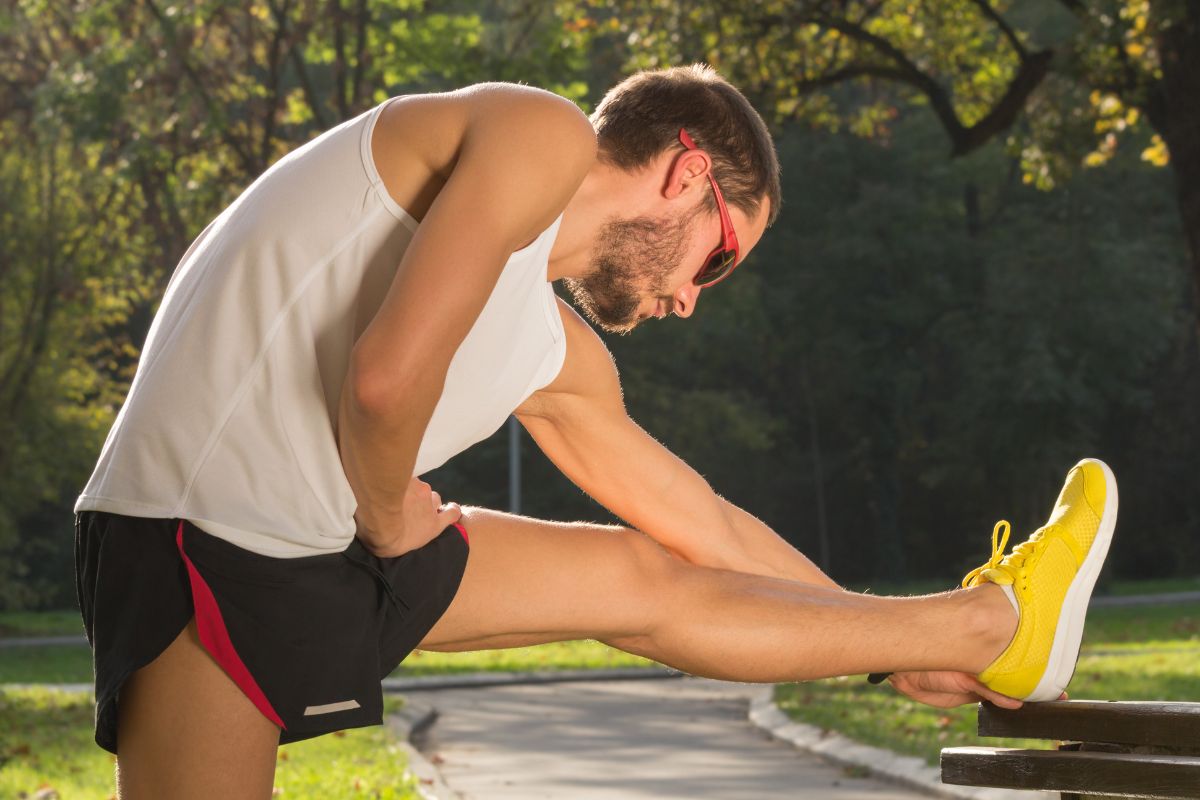 A picture shows a man stretching.