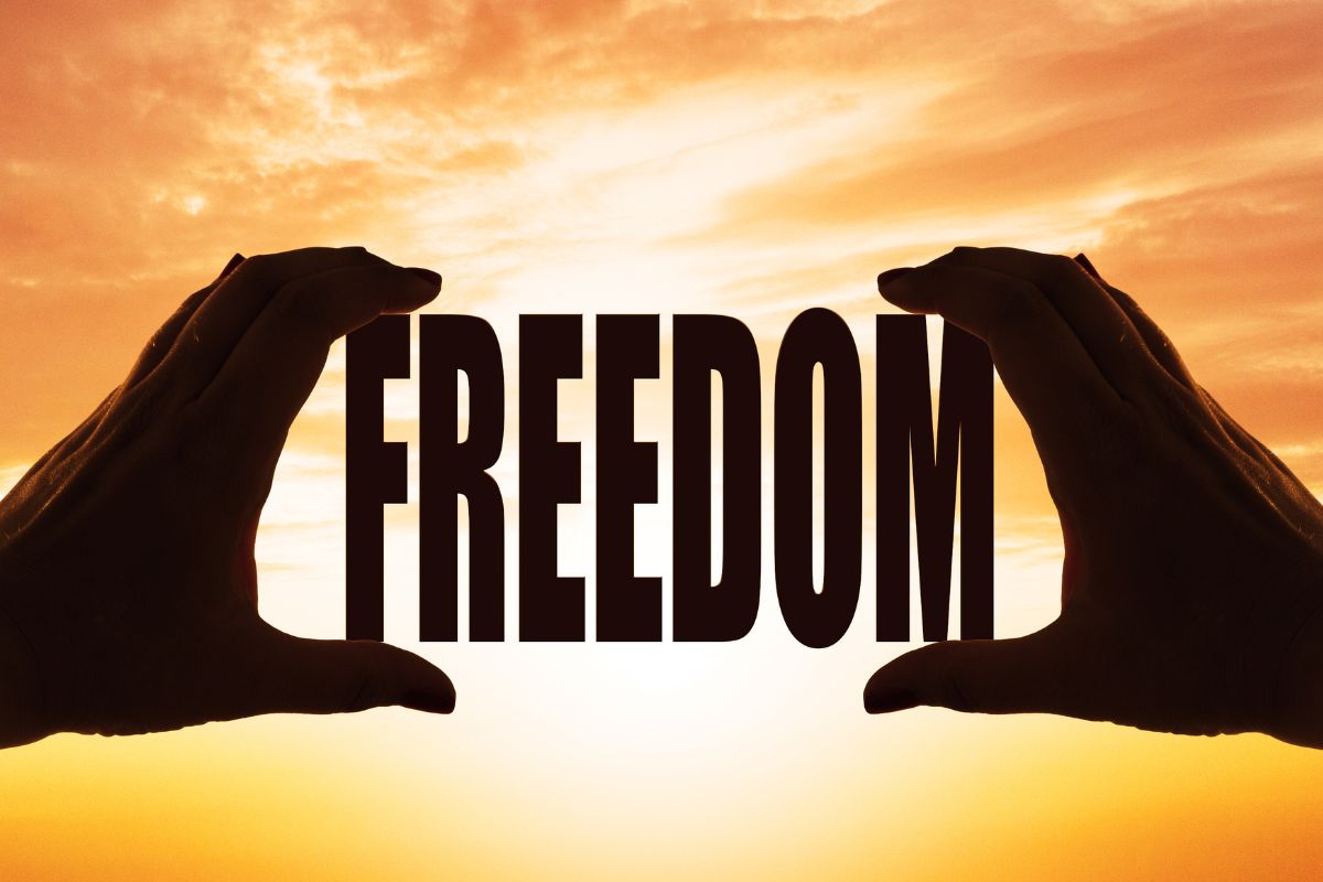 A picture shows a man's hand showing a freedom word.