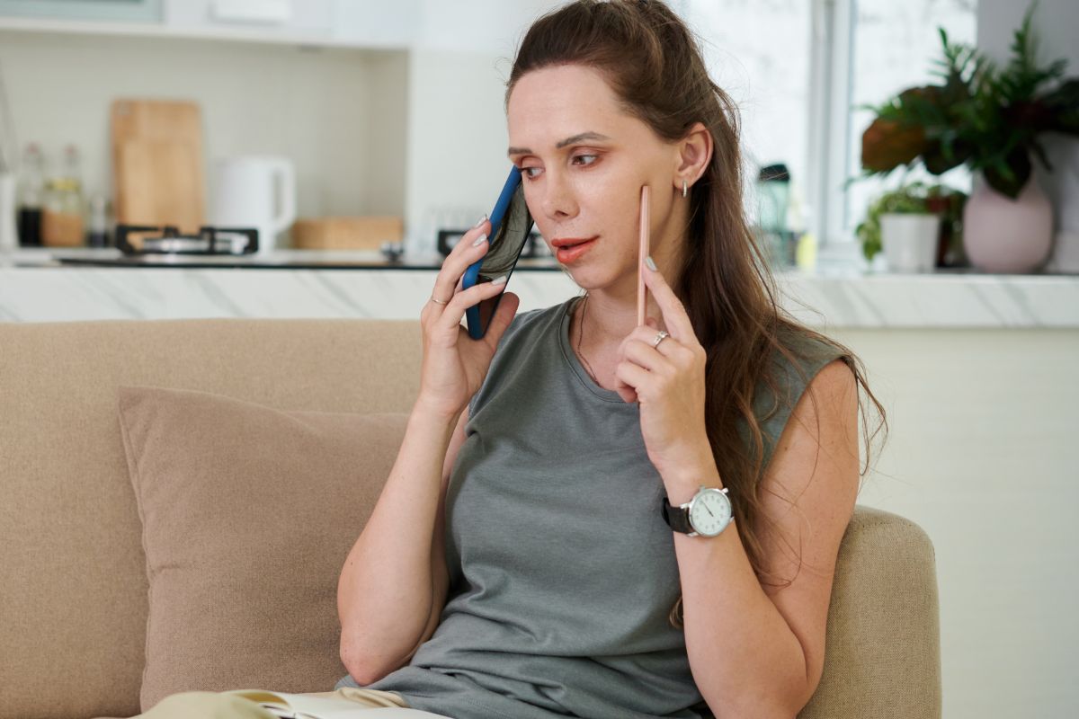 A picture tells about a woman making a phone call.