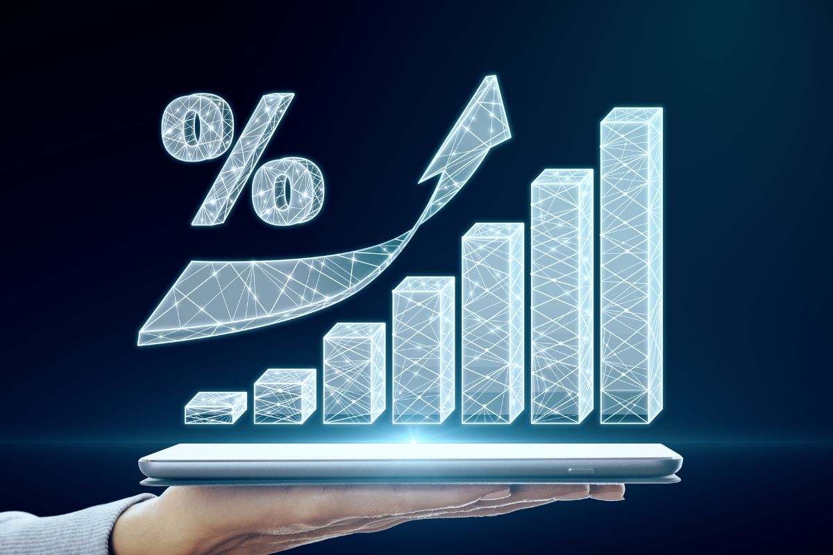 An image shows a man's hand showing a graph.