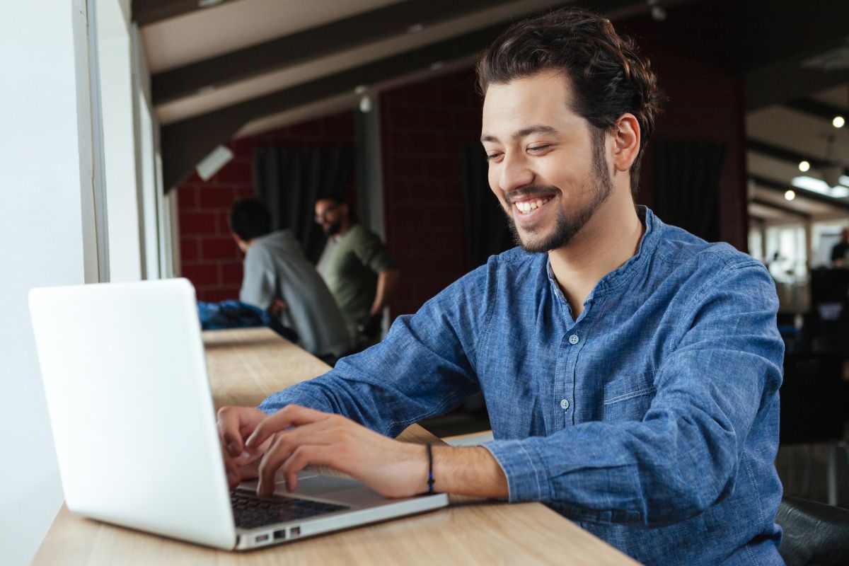 A picture shows a man using a laptop.