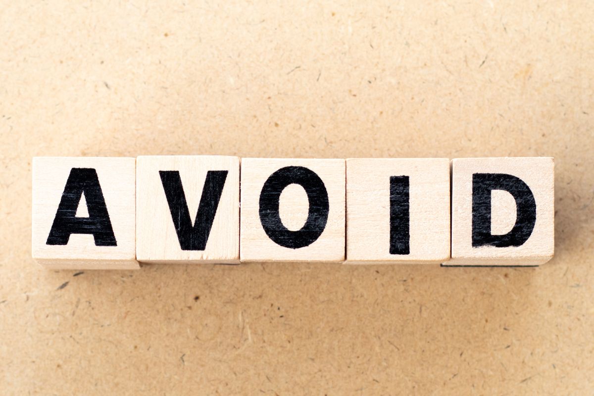 An image of an avoid wording on wooden cubes.