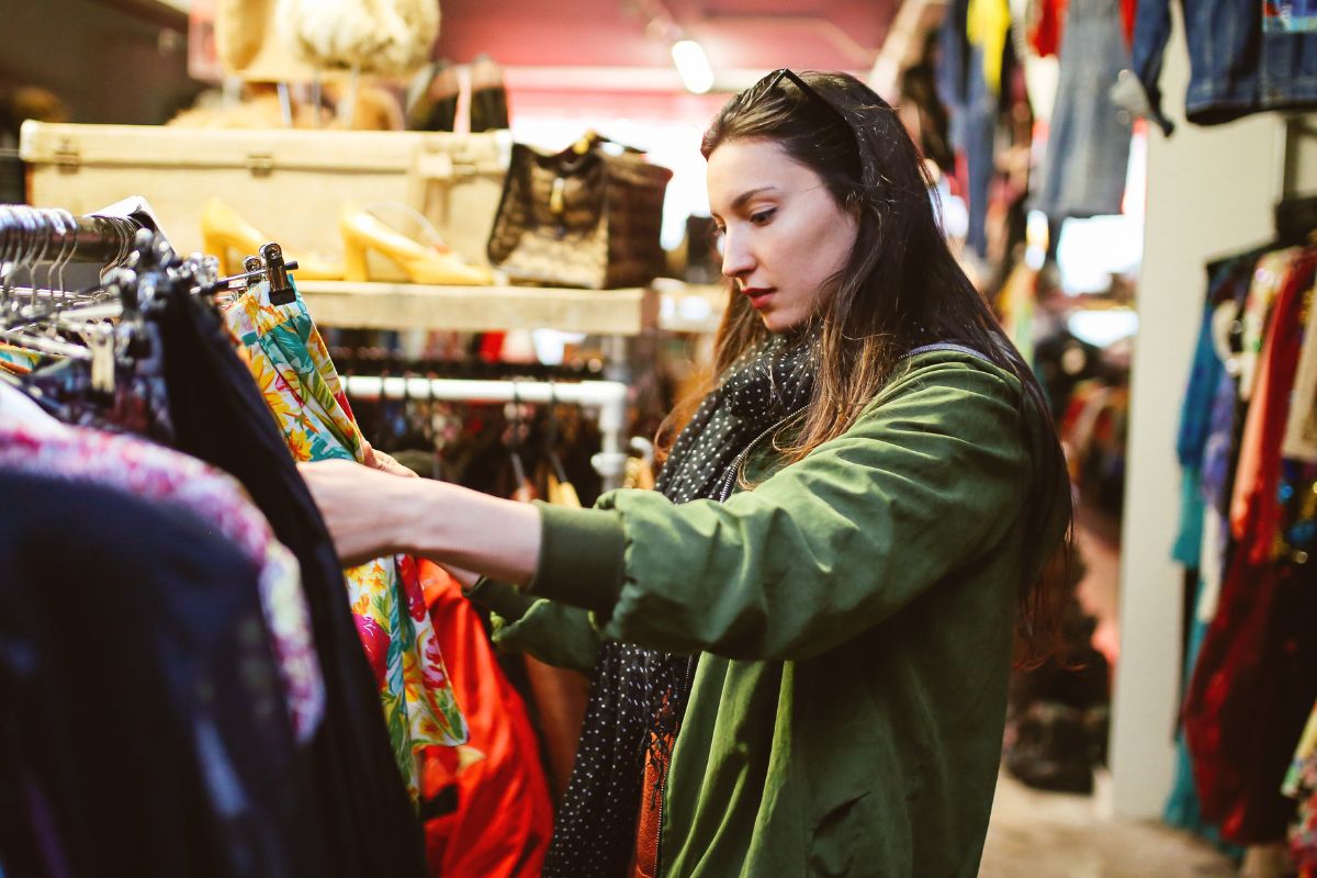 A picture shows a woman shopping for clothes.