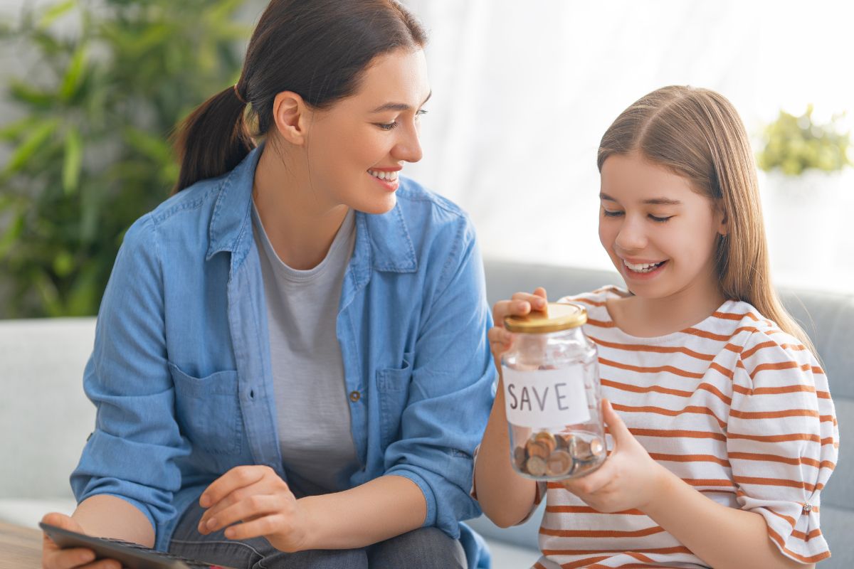 An image of a mother and her child saving money.