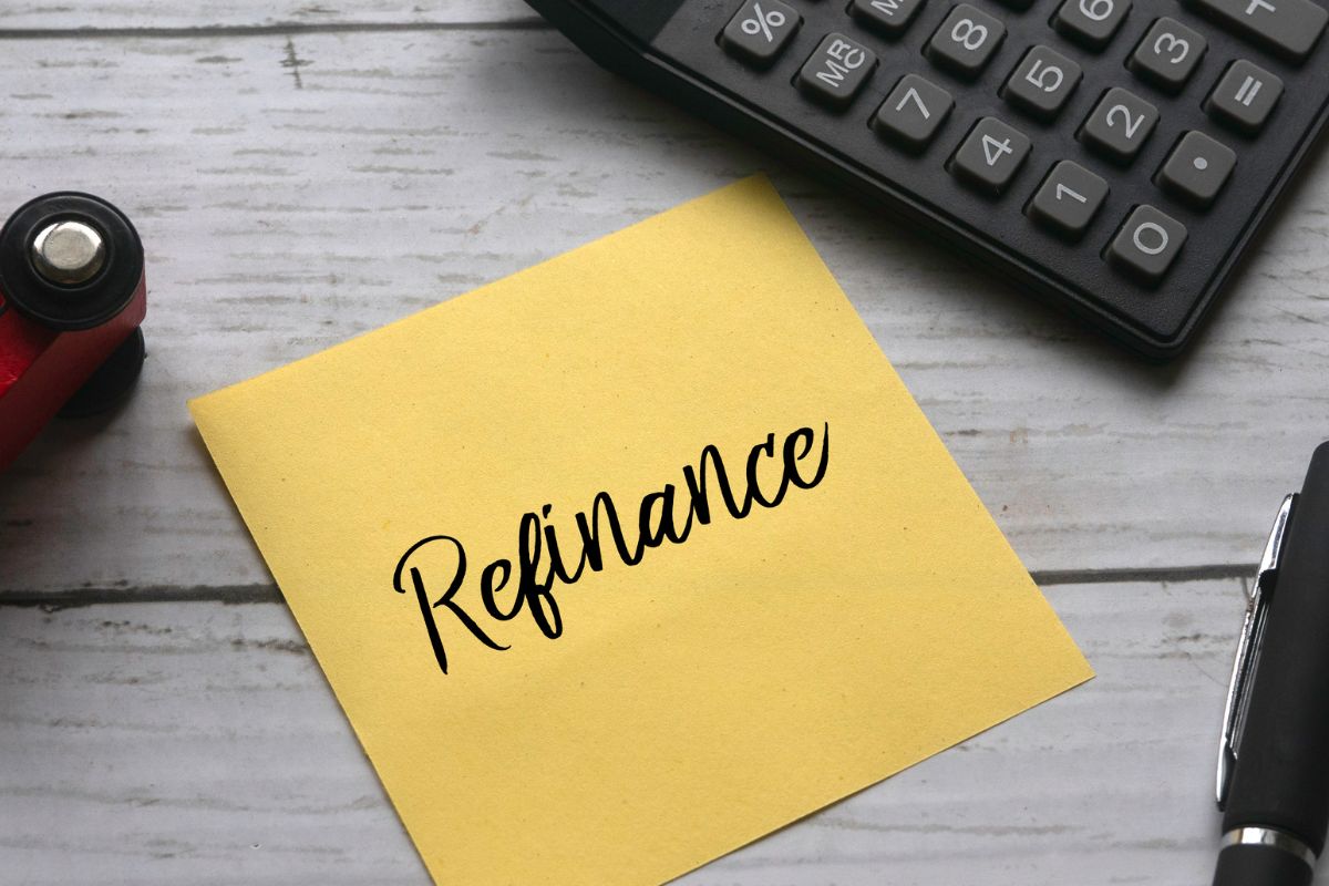 An image of a paper with refinance wording.