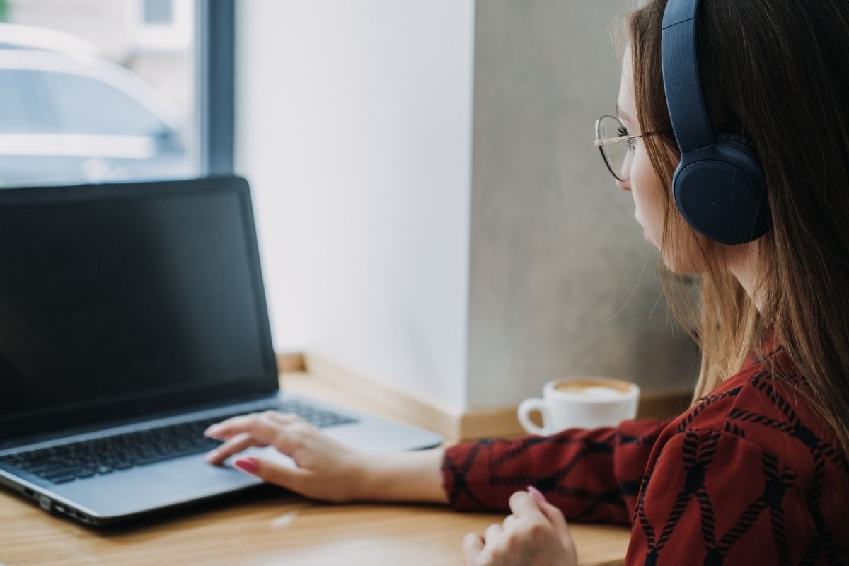 An image of a young lady using a laptop.