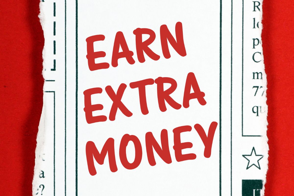 Un papier avec des mots sur gagner de l'argent supplémentaire.