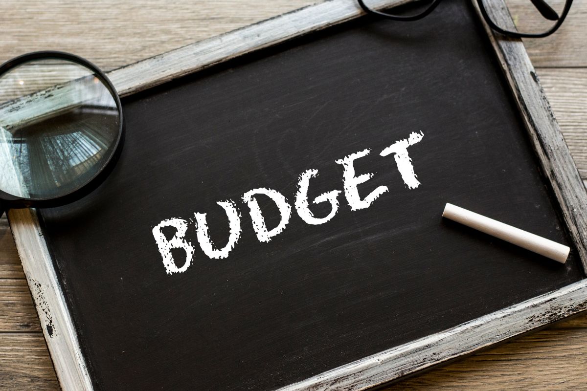 An image of a blackboard with budget wording.