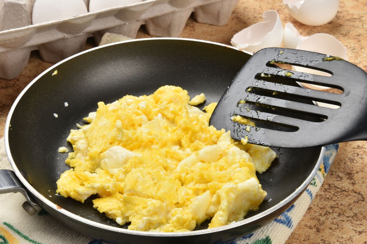 An image of a scrabbled egg in a pan.