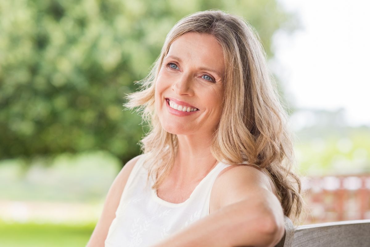 A picture shows a happy woman.