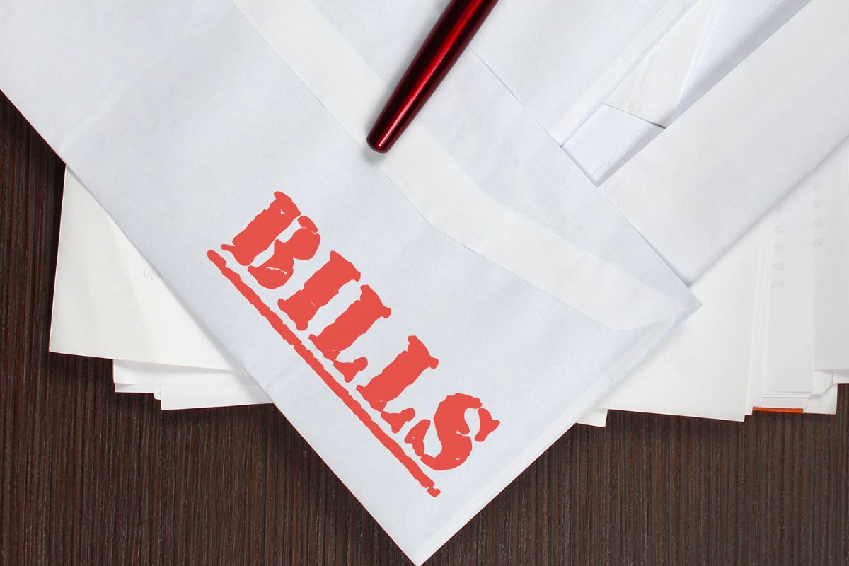 A picture of envelopes with bills wording.