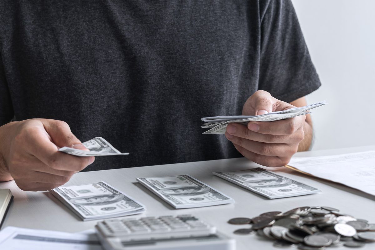 A picture shows a man budgeting money.