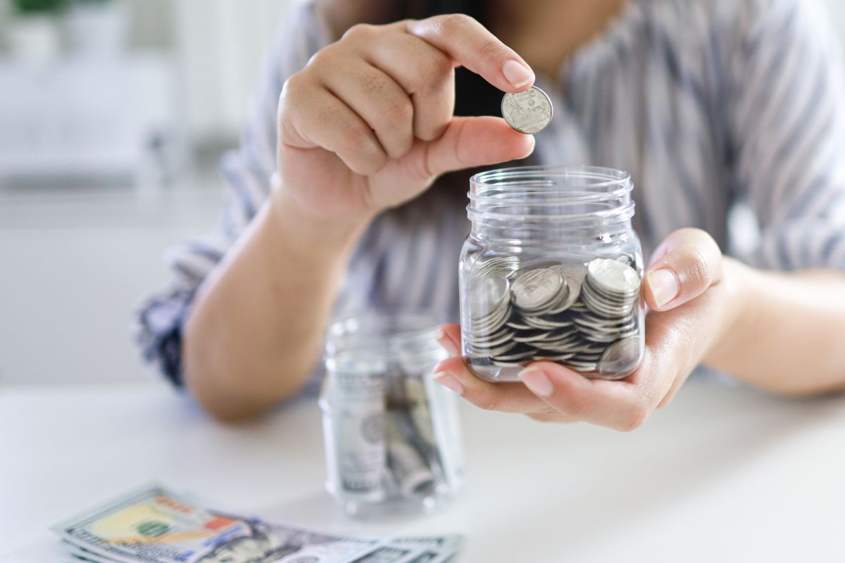 A picture of a woman saving money.