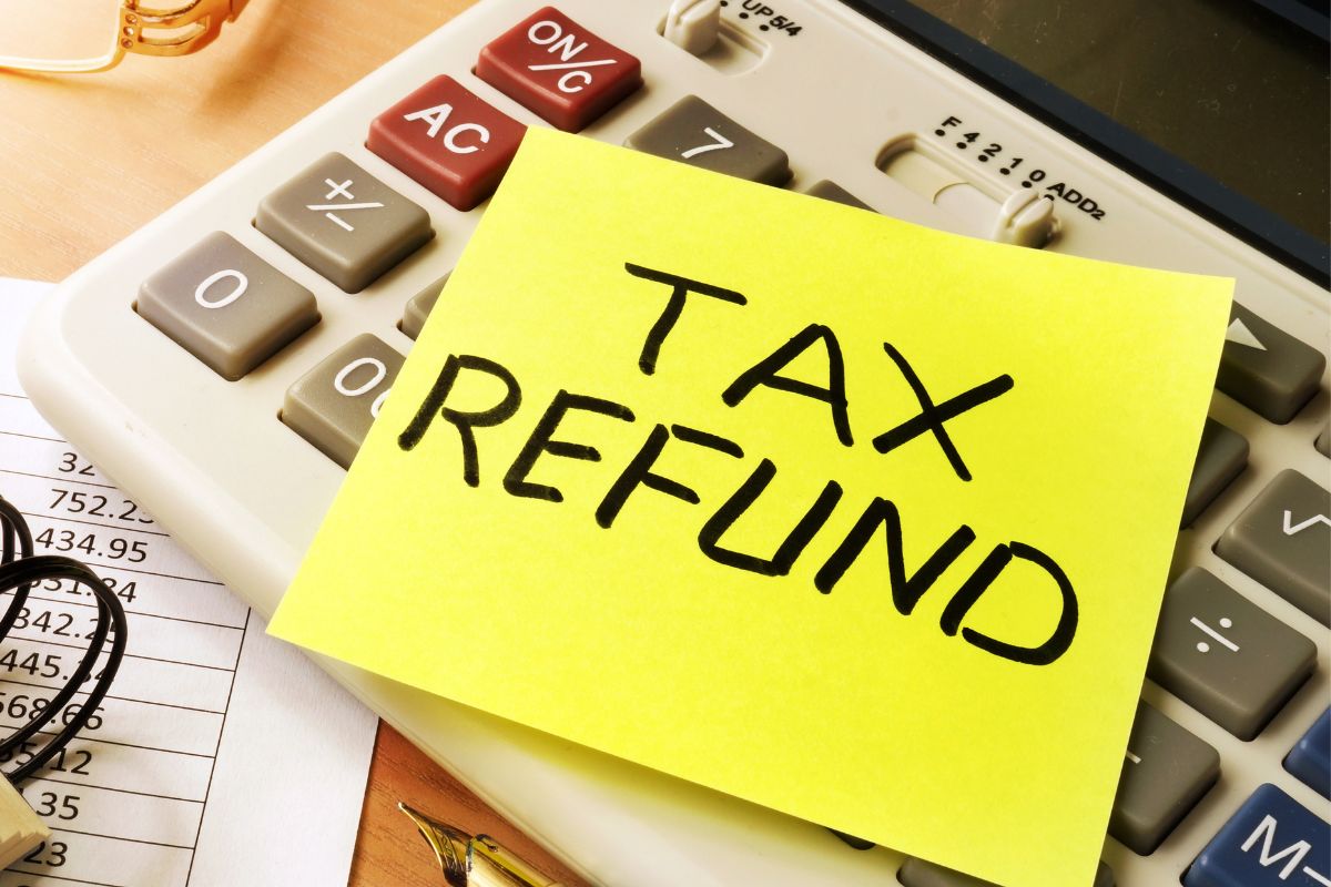 An image shows a paper with tax refund wording.