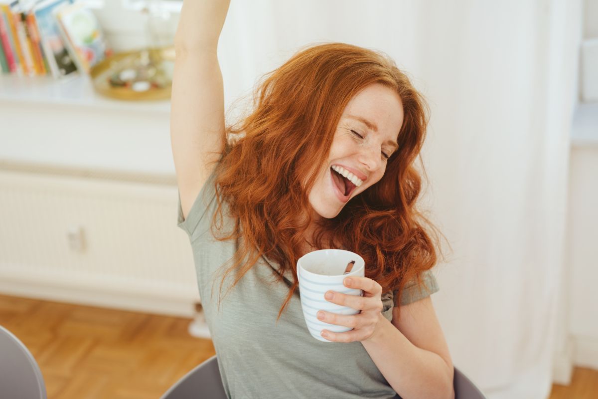 A picture shows a woman cheering.