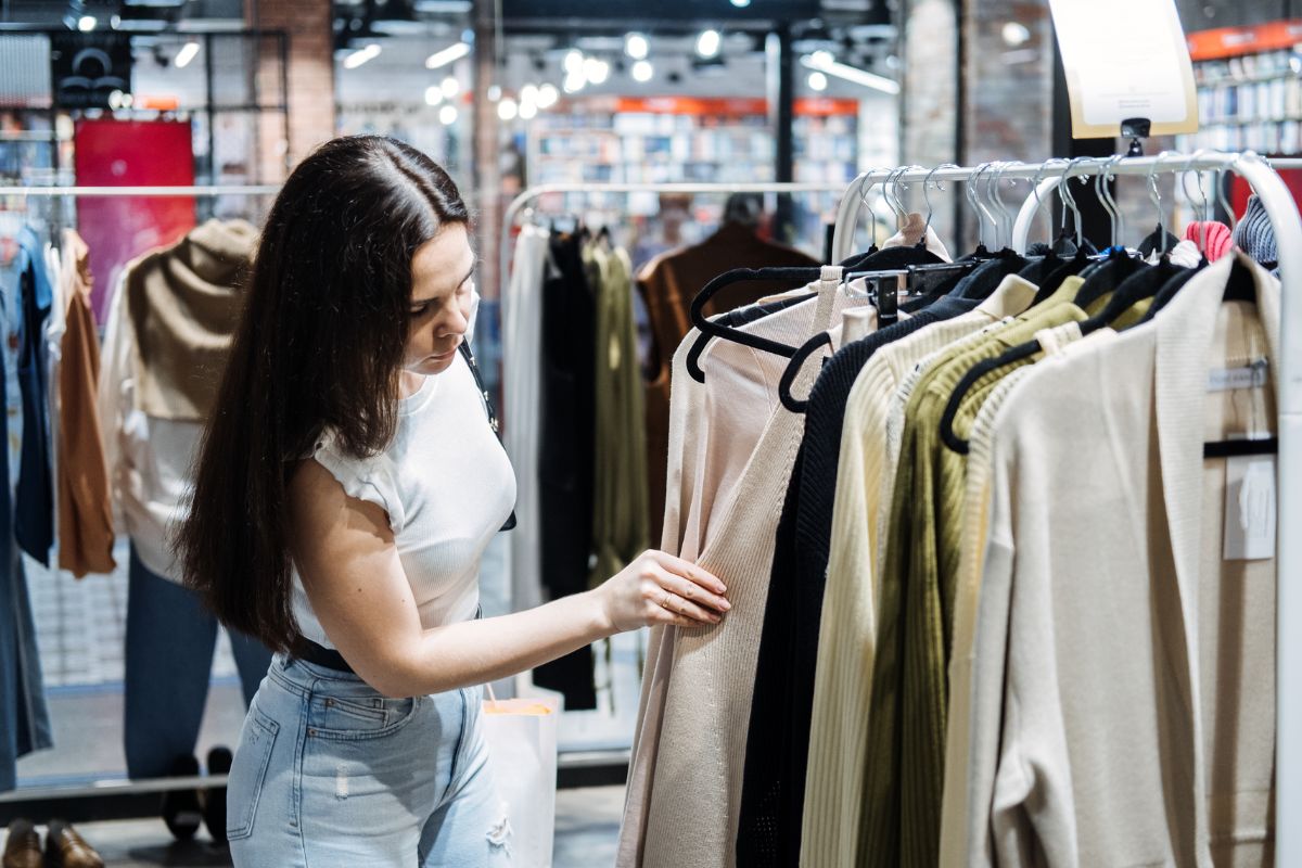 An image of a woman shopping for clothes.