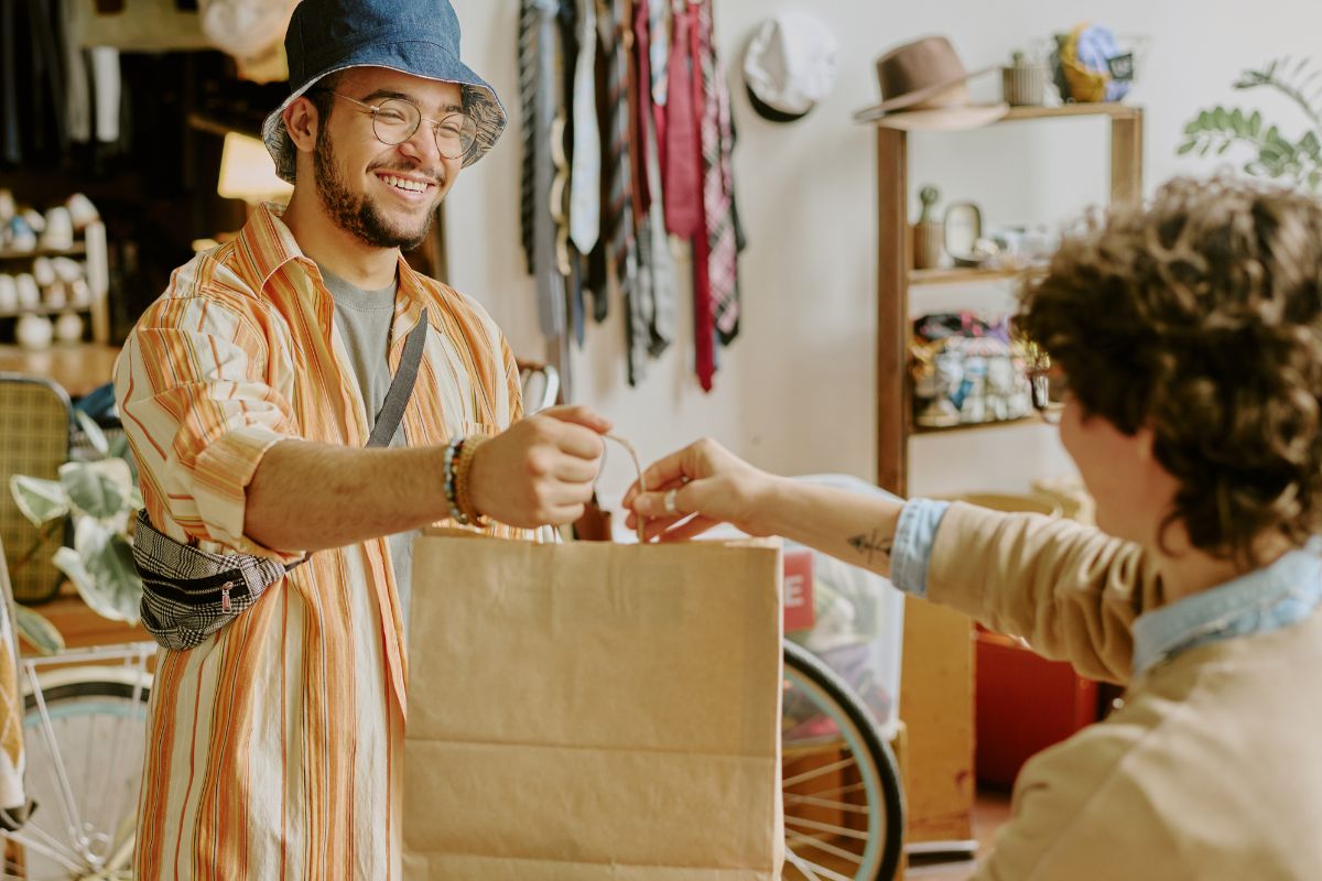 A picture shows a man shopping for clothes.