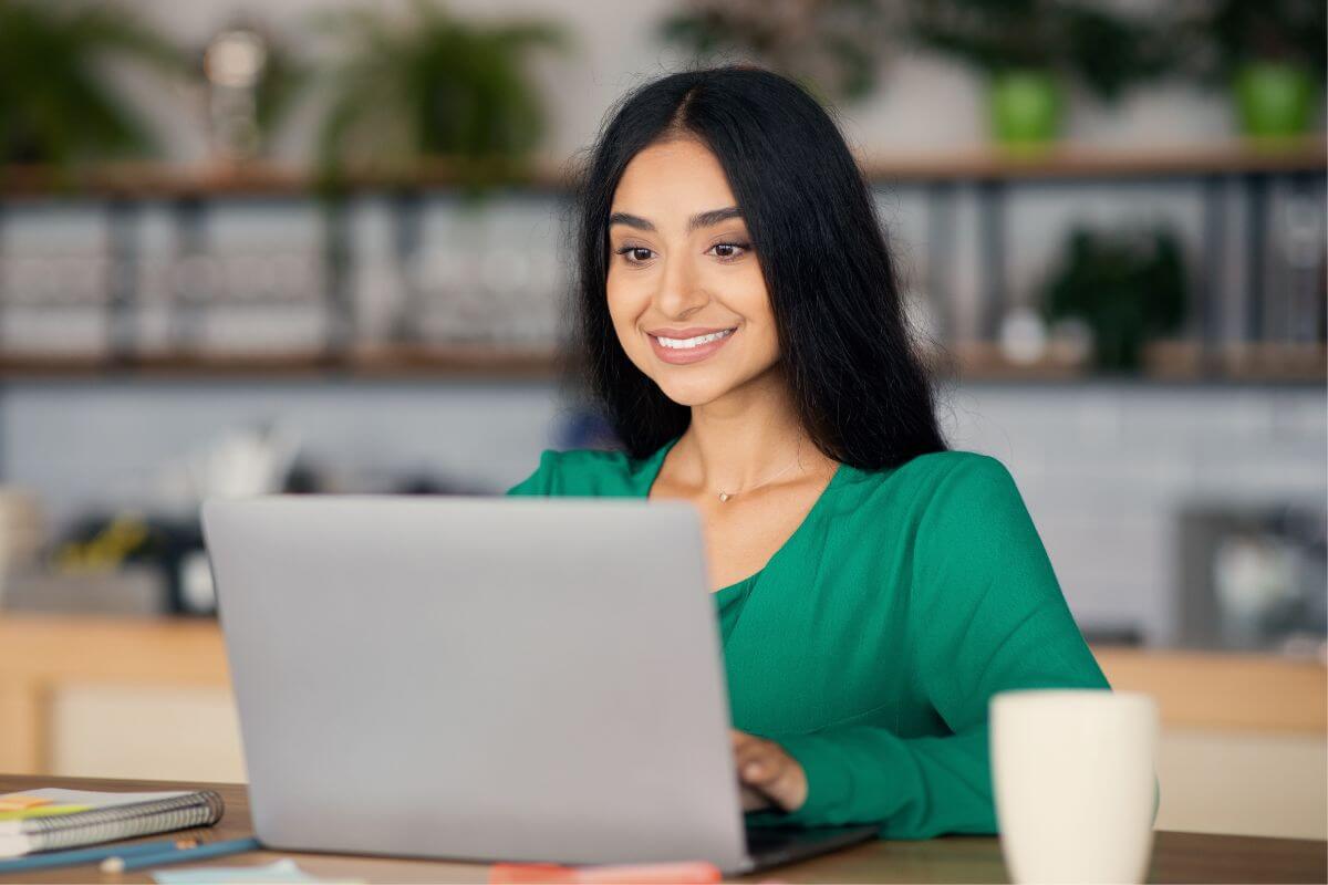 A picture shows a woman using a laptop.