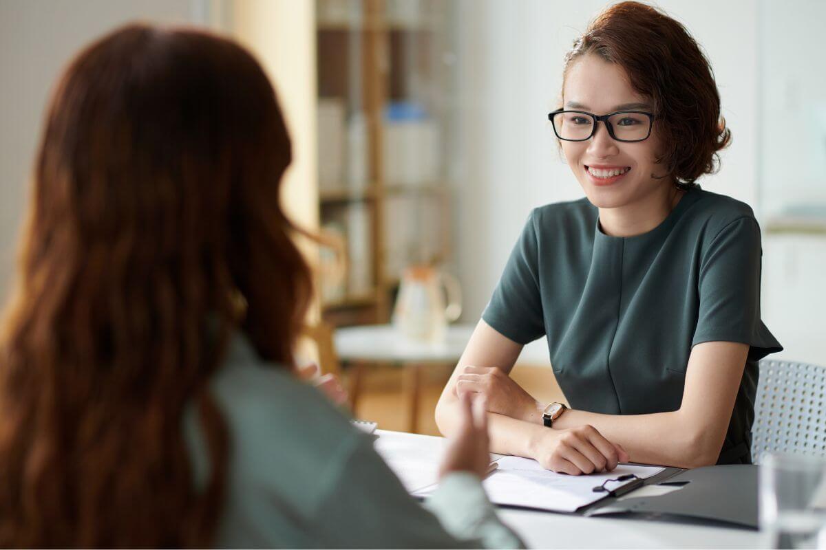 A picture of a student talking to a counselor.