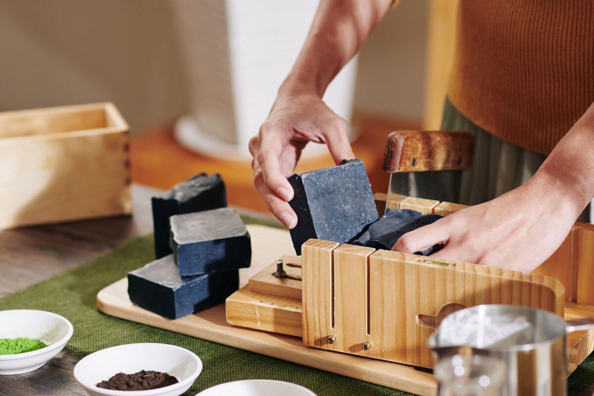 A picture shows a woman making bar soap.